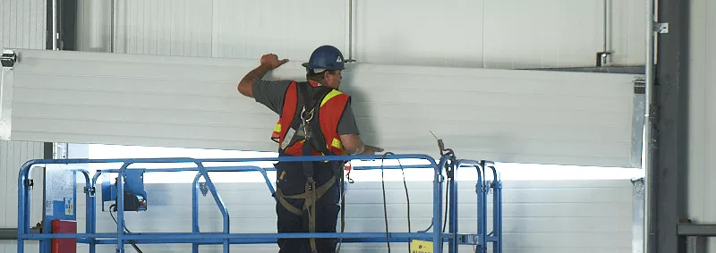 Installer installing a garage door