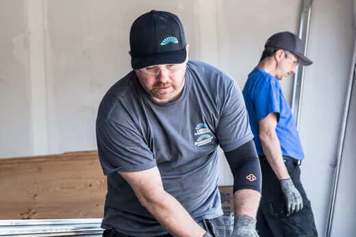 Two men working in a garage